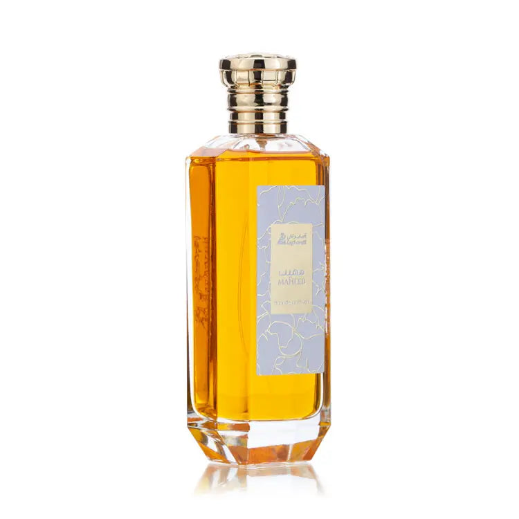 Perfume bottle with a gold cap on a white background